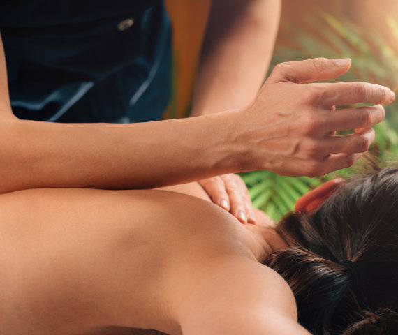 Deep Tissue Massage Deep Tissue Massage Therapy. Therapist massaging Woman’s Back, using Elbow Pressure.